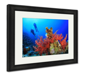 Framed Print, Two Scuba Divers Dive Over A Beautiful Coral Reef In Clear Blue Sea