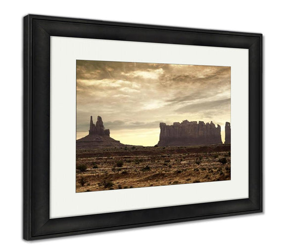 Framed Print, Rock Formations In Monument Valley Under A Dramatic Sky